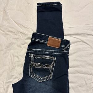 Maurice’s medium regular stretch skinny blue jeans.